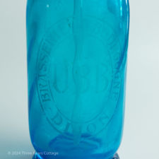 Close up of logo on Brasserie La Bourgogne Blue Glass Soda Siphon