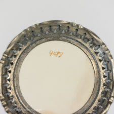 The maker's pattern 4488 identification on a 1920s Metal & Ceramic Yellow Flower Coaster