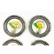 Close up of the last two 1920s Metal & Ceramic Yellow Flower Coasters