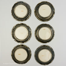 Main underside view of 1920s Metal & Ceramic Yellow Flower Coasters