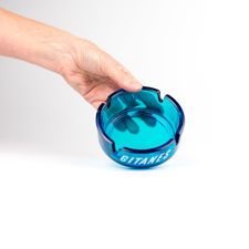 Size demonstration of an Opalex blue glass Gitanes ashtray