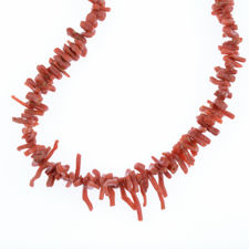 Close up view of vintage red coral necklace