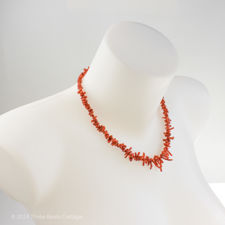 Angled fitting demonstration of vintage red coral necklace