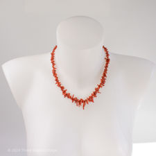 Front facing fitting demonstration of vintage red coral necklace