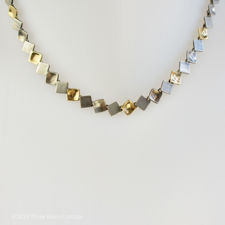 Close up view of a vintage Silver, Brushed Silver & Gold Vermeil Square Necklace