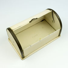 Interior view of an open Art Deco 1930s German Metal Spritzdekor Biscuit Tin