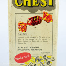 Close up side view of a large retail Chest brand cough sweets tin