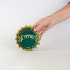 Size demonstration of Green and Yellow Perrier Bottle Cap Ashtray