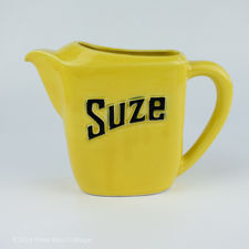 Left side view of a Yellow Moulin des Loups Suze Jug