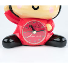 Close up view of clock face on Pucca Korean cartoon character alarm clock